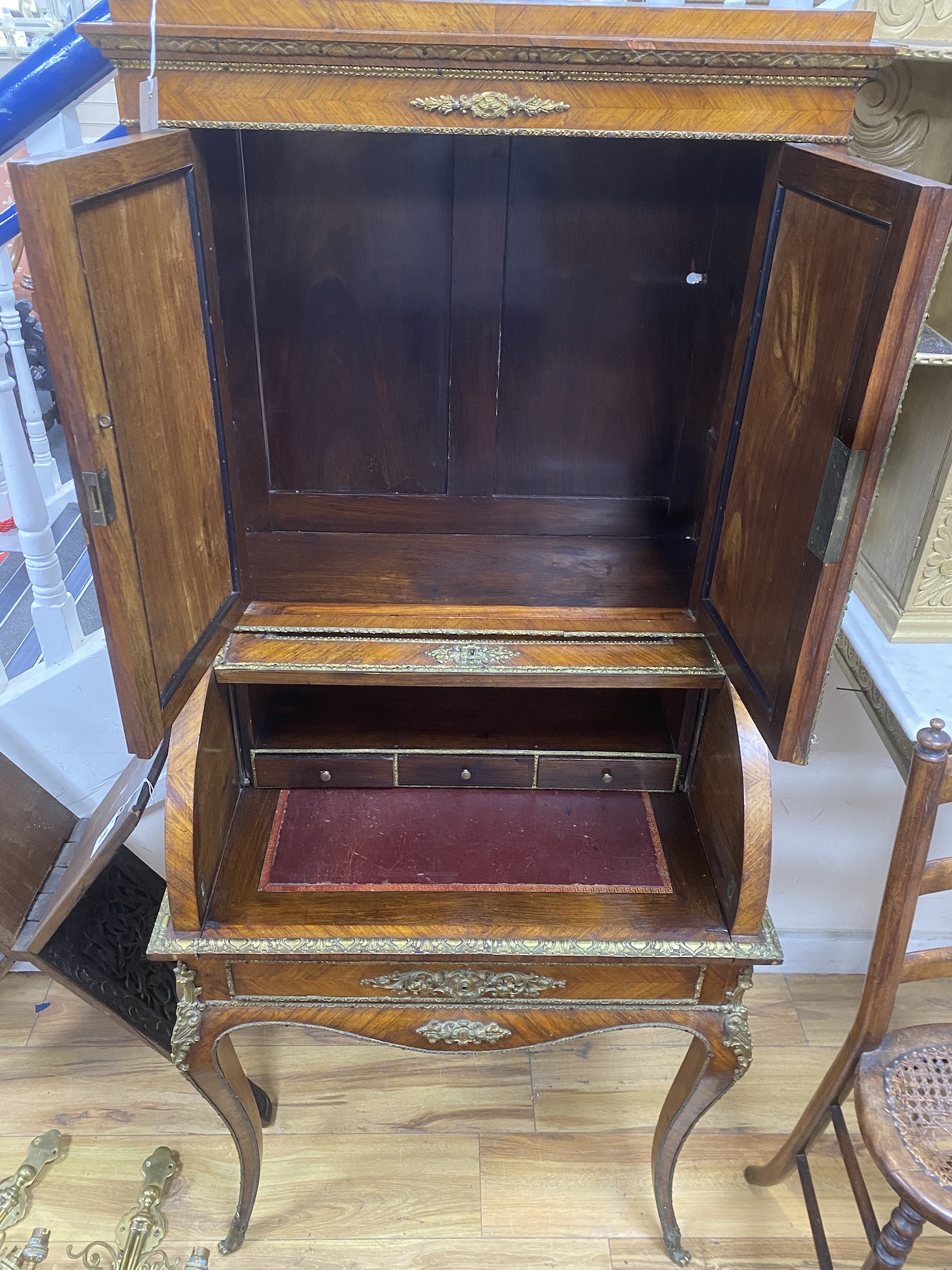 A French gilt metal mounted kingwood cylinder bureau cabinet, width 69cm, depth 50cm, height 157cm